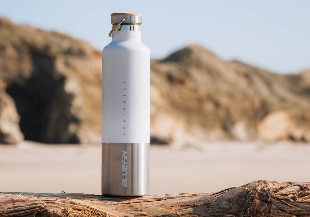 White stainless steel water bottle with a silver base, labeled 'BLUEFIN' and 'EQUIPMENT'.