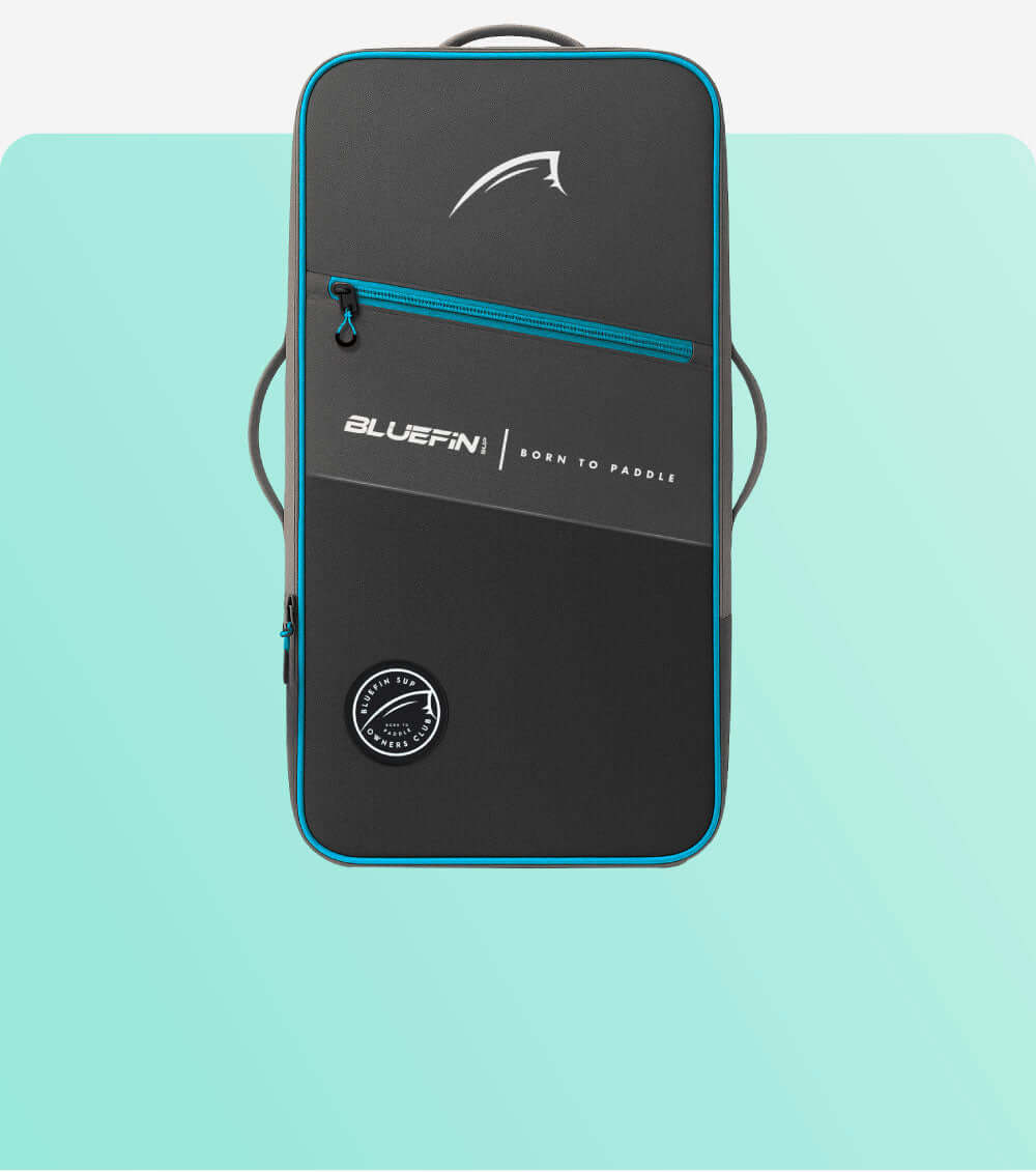 Black and blue backpack with zipper, logo, and carrying handles for paddleboard storage