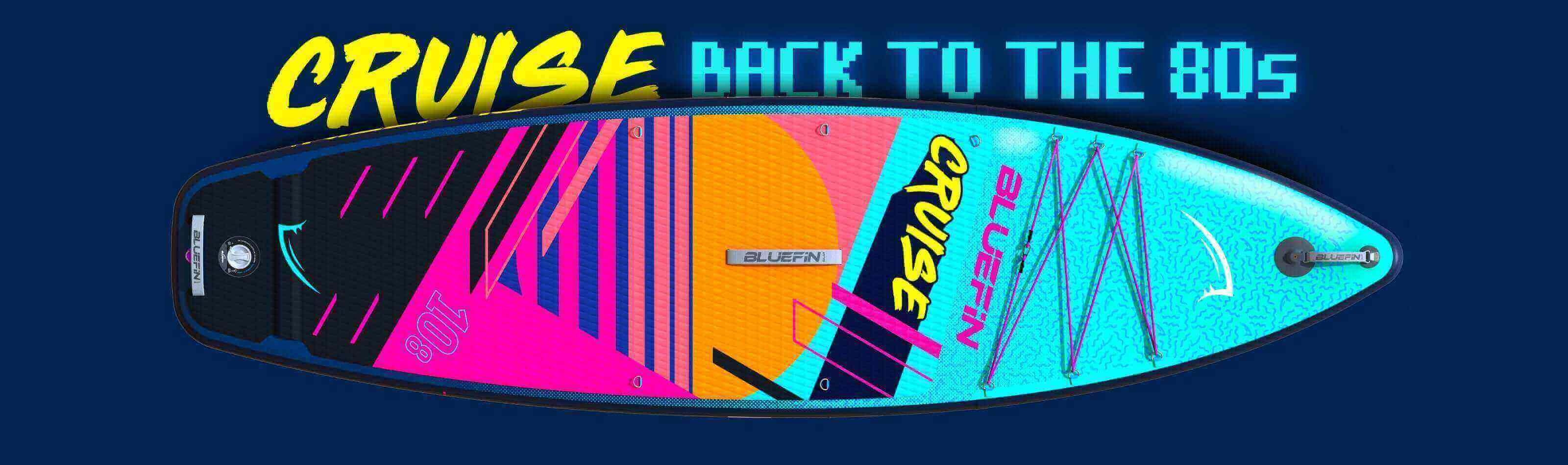 Colorful inflatable paddleboard with textured deck, center fin, and branding in vibrant 80s style.
