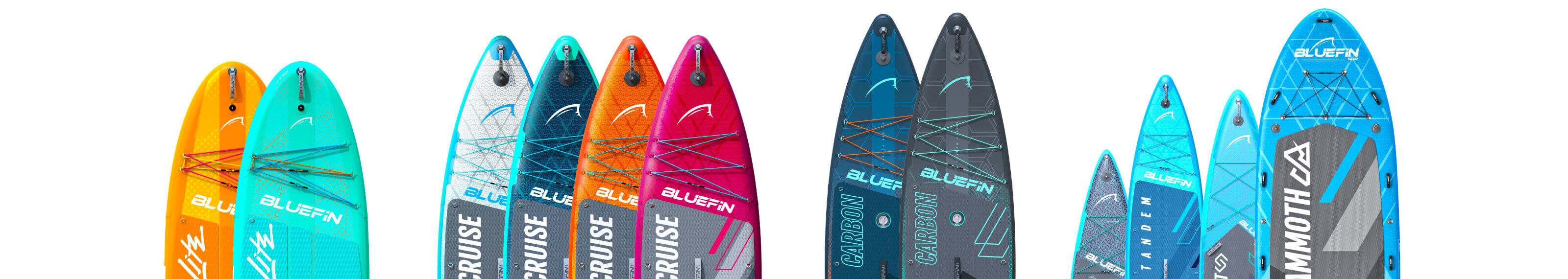 Colorful inflatable paddleboards with textured decks, fins, and bungee cords for storage.