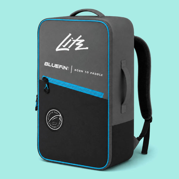 Gray backpack with blue accents, featuring Bluefin logo and Born to Paddle text, side handle and straps.